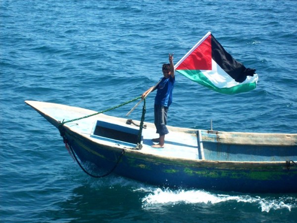 Ibrahim, son of a Palestinian fisherman, waits for the Freedom Flotilla in Gaza City harbour, 30 May 2010